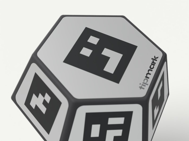 Close-up of the PEN-10 head: matte aluminium code tiles set into the black printed nylon faces